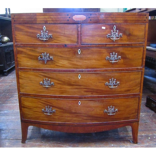 1529 - A Regency mahogany bow fronted chest of three long and two short drawers with caddy top and raised o... 