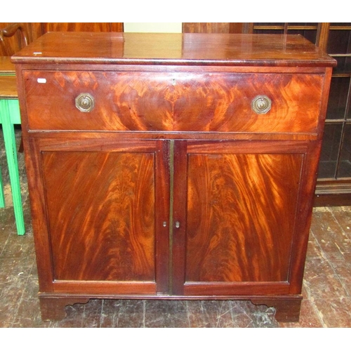 1531 - A Georgian mahogany cupboard enclosed by a frieze drawer and a pair of panelled doors raised on brac... 