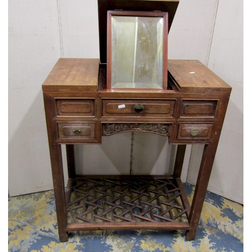 1537 - A Chinese dressing table,the central rising cover enclosing a bevelled edge mirror plate flanked by ... 