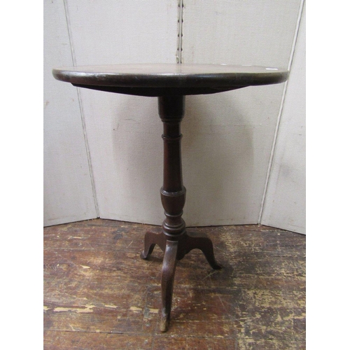 1545 - Georgian oak snap top table,the circular top raised on a turned pillar and tripod base