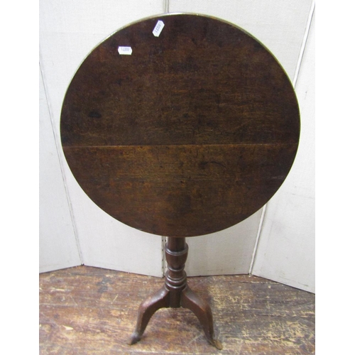 1545 - Georgian oak snap top table,the circular top raised on a turned pillar and tripod base