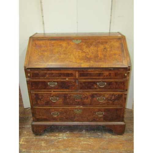 1548 - An 18th century walnut writing bureau,the front elevation enclosed by two long and two short drawers... 