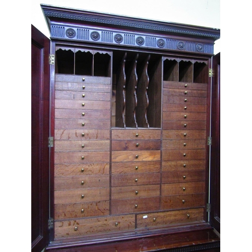 1549 - A Georgian mahogany state office cabinet the lower section enclosed by two panelled doors fitted wit... 