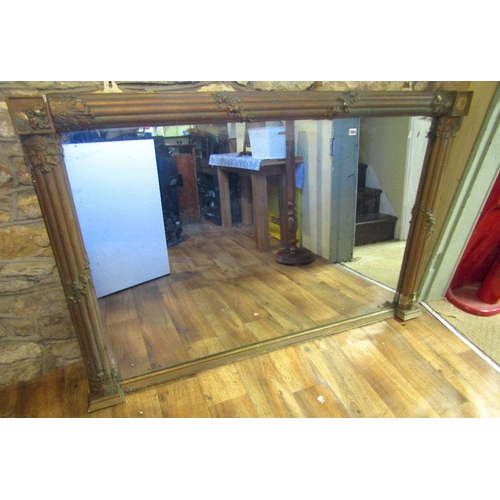 1563 - A large 19th century gilt frame overmantle mirror,the large rectangular plate set within a split clu... 
