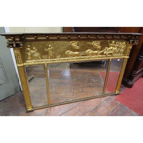 1564 - A Regency three pane overmantle mirror with bevelled edge plate,beneath a classical frieze showing a... 