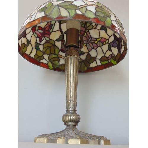 589 - Tiffany style leaded glass table lamp,decorated with butterflies amidst foliage,45cm high