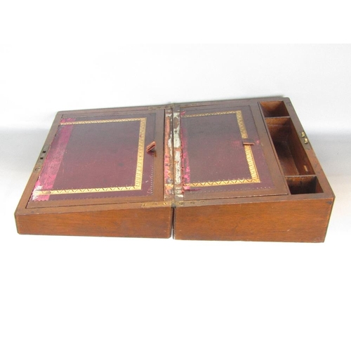 590 - A good quality burr walnut writing slope,with domed hinged top enclosing two ceramic inkwells and fu... 