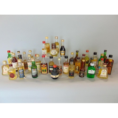 592 - A box containing a collection of mainly whiskey miniatures