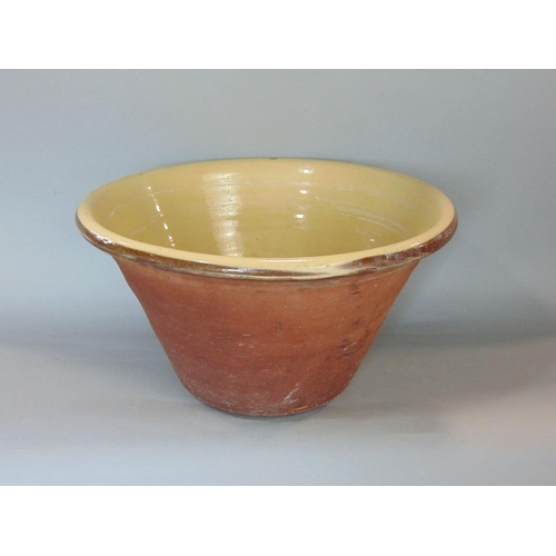 593 - A good quality slipware glazed terracotta dairy bowl,43cm diameter