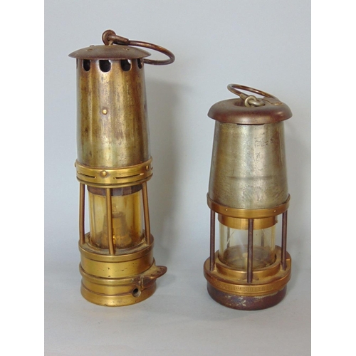 599 - Two antique steel and brass miners lamps,the largest by The Wolf Safety Lamp Co,Sheffield,the other ... 