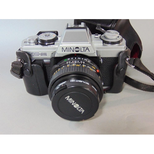 603 - Vintage Minolta camera with leather carry case,together with a collection of various Minolta Panason... 