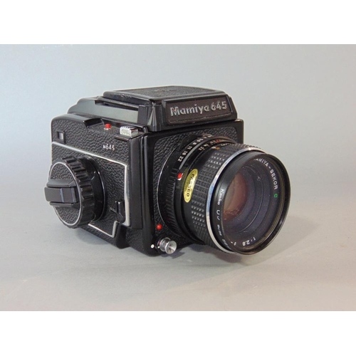 605 - Mamiya 645 camera with 80mm lens and various reels and others (a collection)