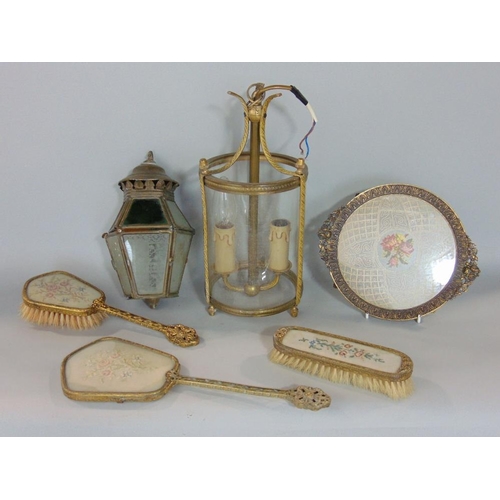 615 - A collection of mixed metalware to include a twin branch hanging cylindrical glass lantern,a further... 