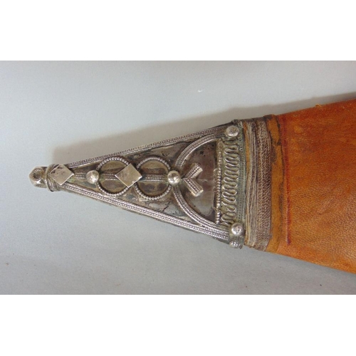 622 - A Sudanese broad sword,with embossed leather scabbard with white metal tip