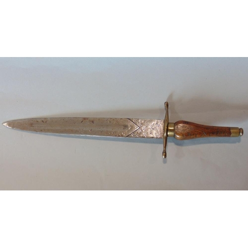 624 - A socket bayonet with brass guard and tapering oak grip