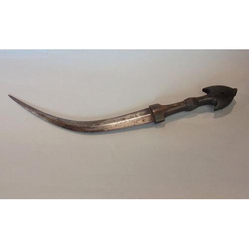 625 - An eastern horn handled dagger with curved and tapering blade