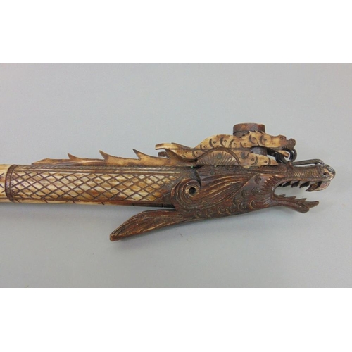 626A - Interesting long carved bone blow pipe in the form of a serpent,together with an antique style mace ... 