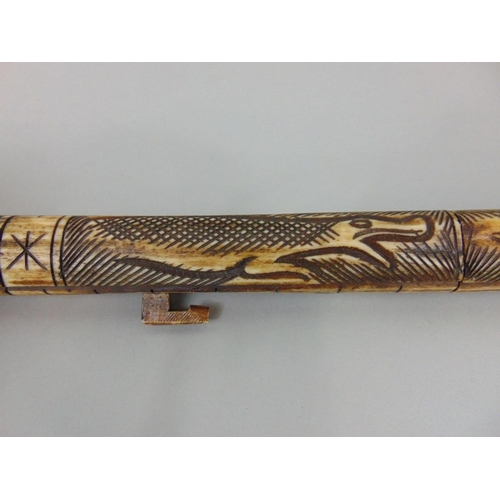 626A - Interesting long carved bone blow pipe in the form of a serpent,together with an antique style mace ... 