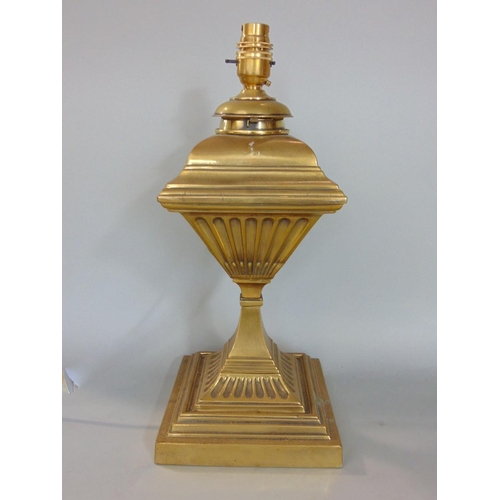 629 - A brass column table lamp on waisted stem and square cut base,a further table lamp and two heavy bra... 