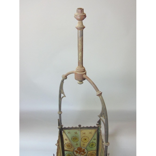 643 - A Victorian brass framed hall lantern of square cut form with original painted leaded light panels o... 