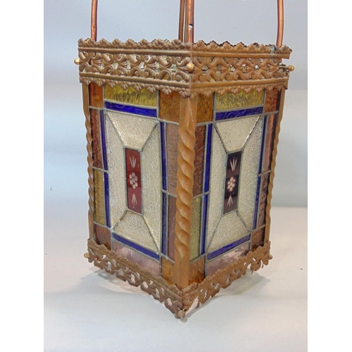 645 - A Victorian brass framed hall lantern,with pierced borders and enclosing geometric leaded light pane... 