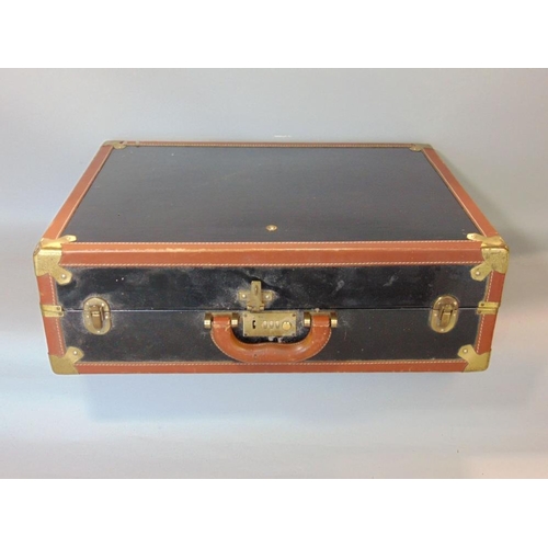 647 - A brief case with tan coloured leather borders,black panels and brass fittings