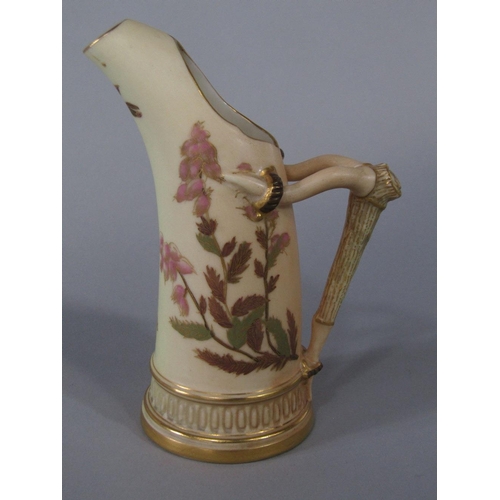 65 - A Royal Worcester blush ivory tusk shaped jug with painted and gilded floral decoration,puce printed... 