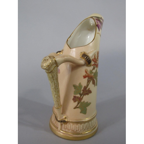 65 - A Royal Worcester blush ivory tusk shaped jug with painted and gilded floral decoration,puce printed... 