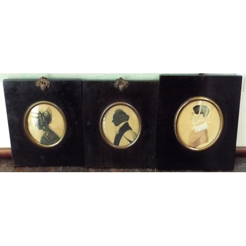 663 - Two early 19th century silhouette profile portrait miniatures,both of oval form,one showing a lady i... 