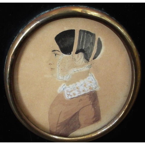 663 - Two early 19th century silhouette profile portrait miniatures,both of oval form,one showing a lady i... 