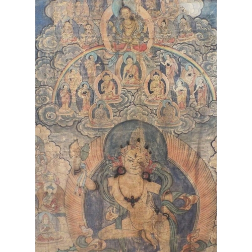 674 - An early 19th century Tibetan Thanka showing a central dancing deity surrounded by a host of further... 