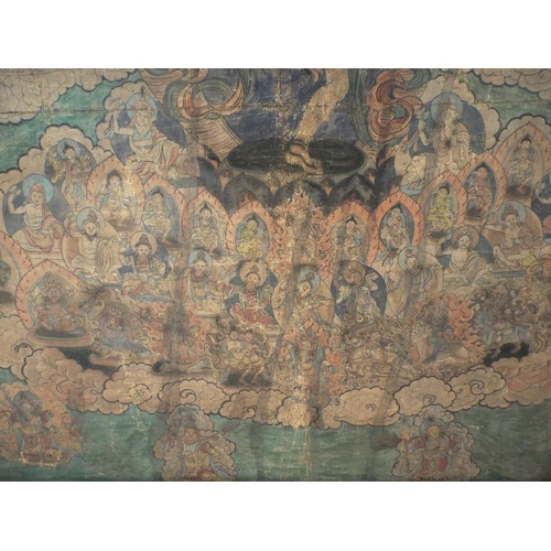 674 - An early 19th century Tibetan Thanka showing a central dancing deity surrounded by a host of further... 