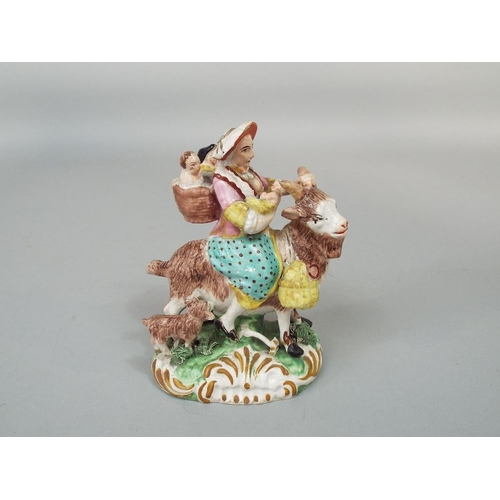 68 - A 19th century Staffordshire figure group of the tailor~s wife riding on a goat,after the Meissen mo... 