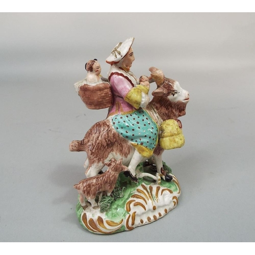 68 - A 19th century Staffordshire figure group of the tailor~s wife riding on a goat,after the Meissen mo... 