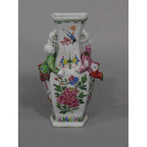 69 - An unusual 19th century oriental wall pocket in the form of a vase with applied figures of climbing ... 