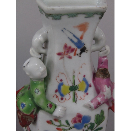 69 - An unusual 19th century oriental wall pocket in the form of a vase with applied figures of climbing ... 