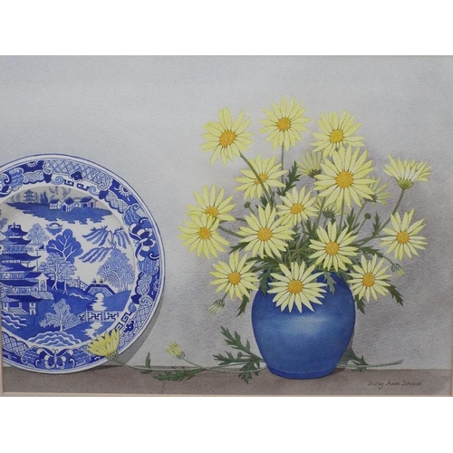 696 - Shirley Anne Johnson (20th/21st century British) - Still life with vase of yellow daisies and blue a... 