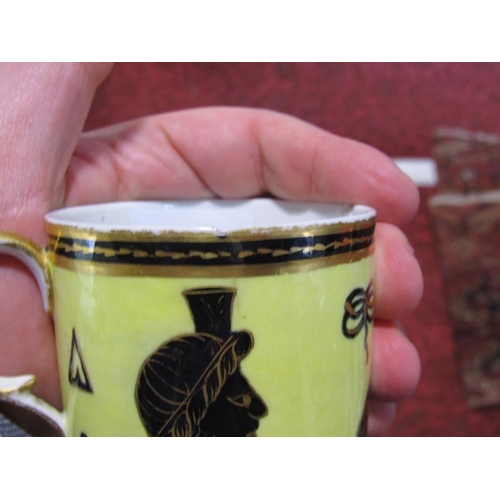 71 - An unusual early 19th century Derby coffee can with black and gilt Egyptian style motifs on a yellow... 