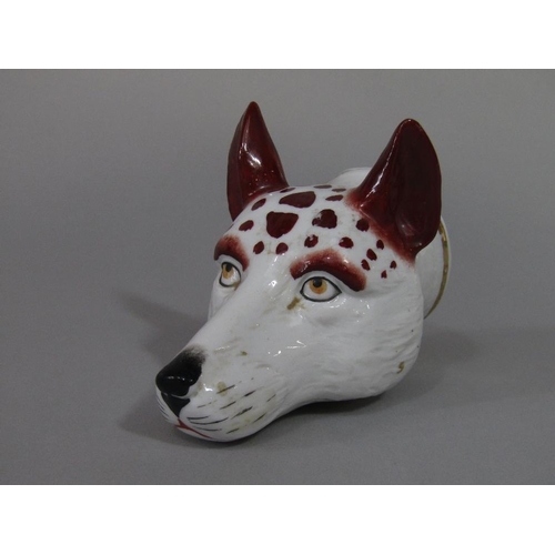 73 - A 19th century stirrup cup in the form of a fox mask,11 cm long approx