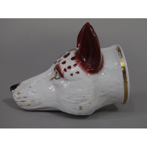 73 - A 19th century stirrup cup in the form of a fox mask,11 cm long approx