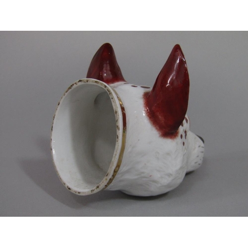 73 - A 19th century stirrup cup in the form of a fox mask,11 cm long approx