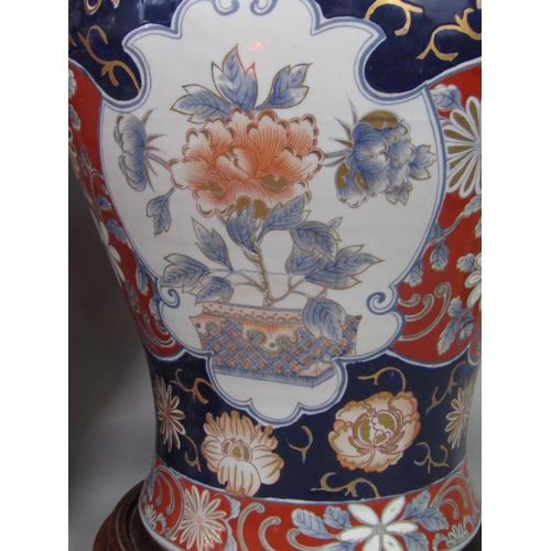 75 - Large pair of Chinese Imari porcelain lidded baluster vases decorated with floral panels,the lids mo... 