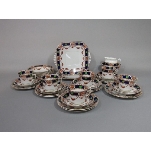 79 - A collection of early 20th century ceramics with printed and infilled border decoration comprising p... 