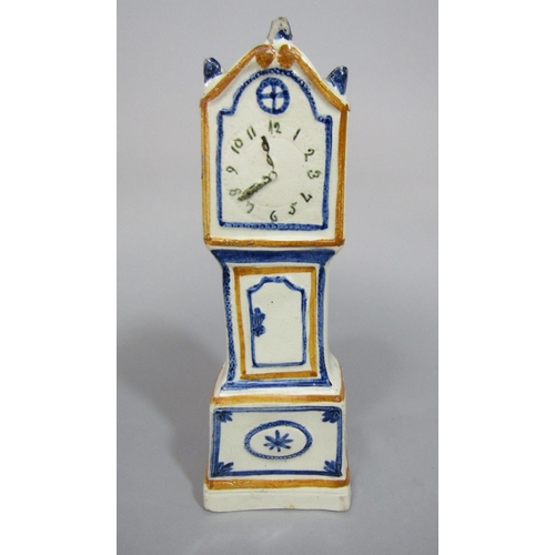 90 - An early 19th century cream glazed model of a miniature longcase clock with painted detail in the Pr... 