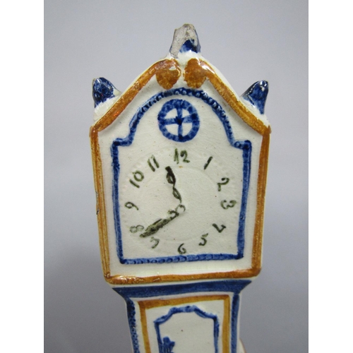 90 - An early 19th century cream glazed model of a miniature longcase clock with painted detail in the Pr... 