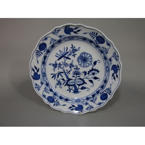 94 - A 19th century Meissen type charger with blue and white painted floral decoration with blue cross sw... 