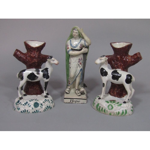 95 - A pair of 19th century pottery spill holders in the form of tree trunks with applied figures of blac... 