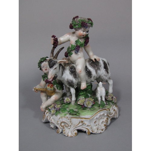 96 - A good quality 19th century continental figure group of a pair of Bacchanalian cherubs,one riding on... 