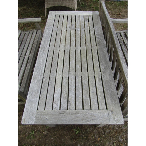 102 - A Barlow Tyrie weathered/silvered teak garden table, with slatted top, raised on square cut supports... 