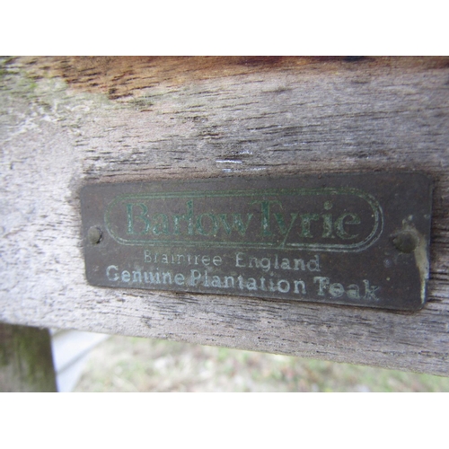 102 - A Barlow Tyrie weathered/silvered teak garden table, with slatted top, raised on square cut supports... 